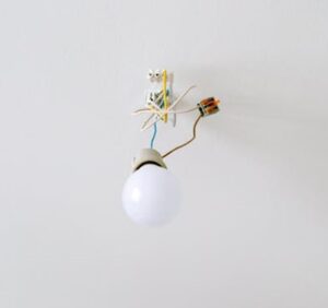 a bulb hanging loosely on wires